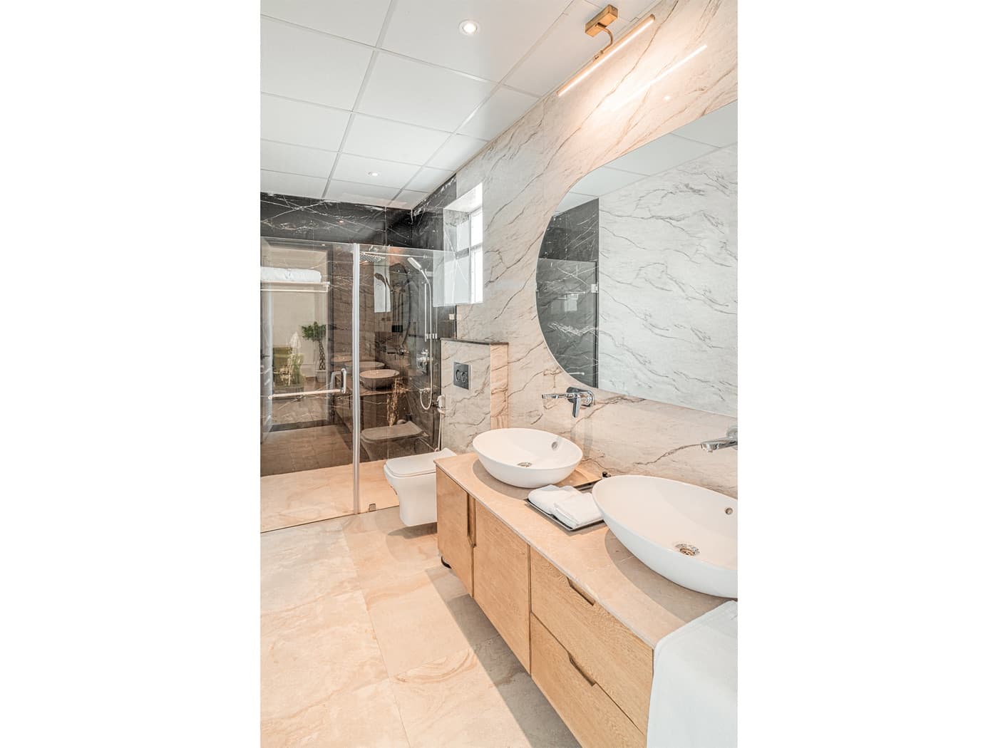 Marble bathroom with dual vessel sinks