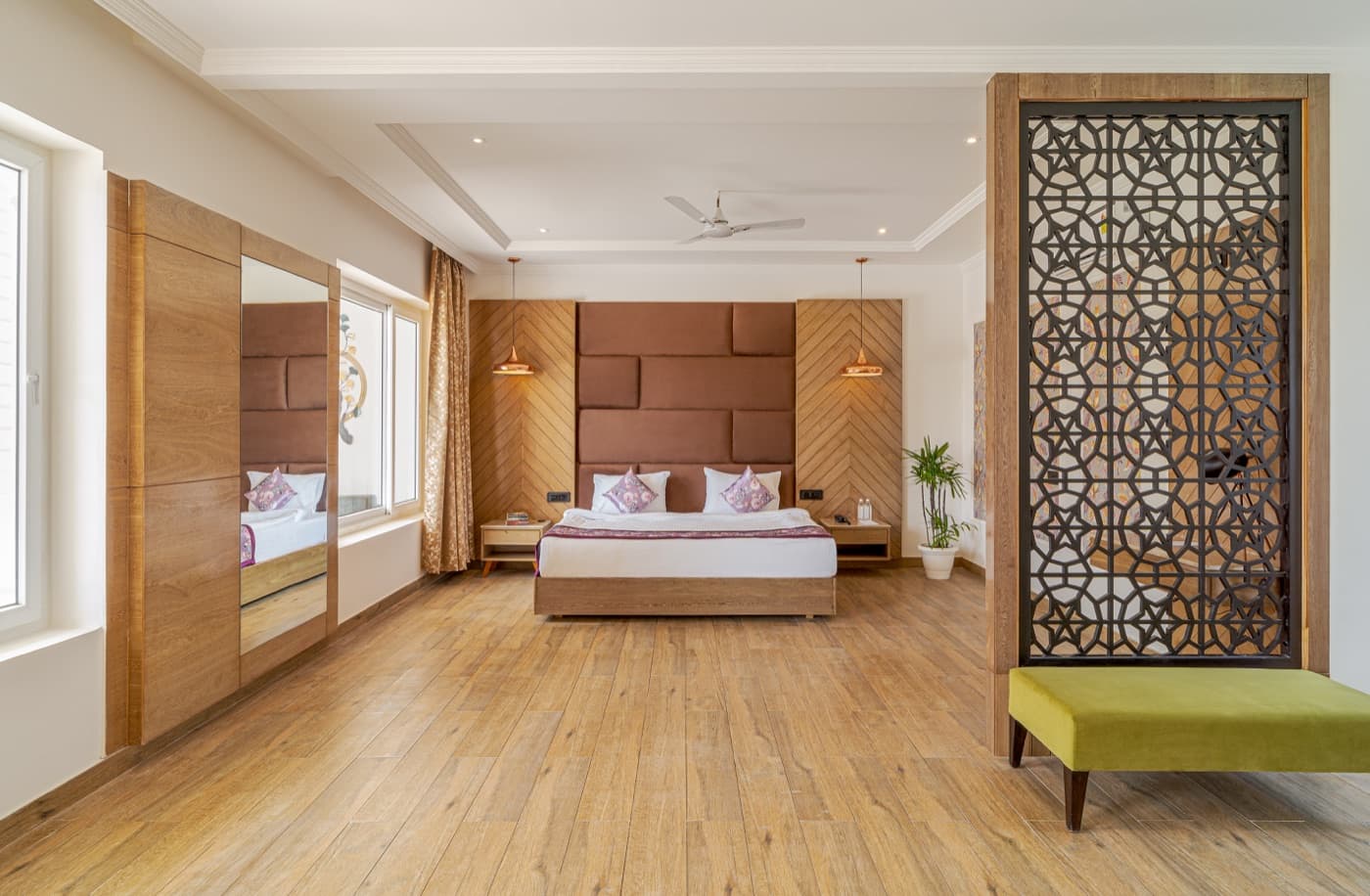 Spacious suite bedroom with jali screen partition