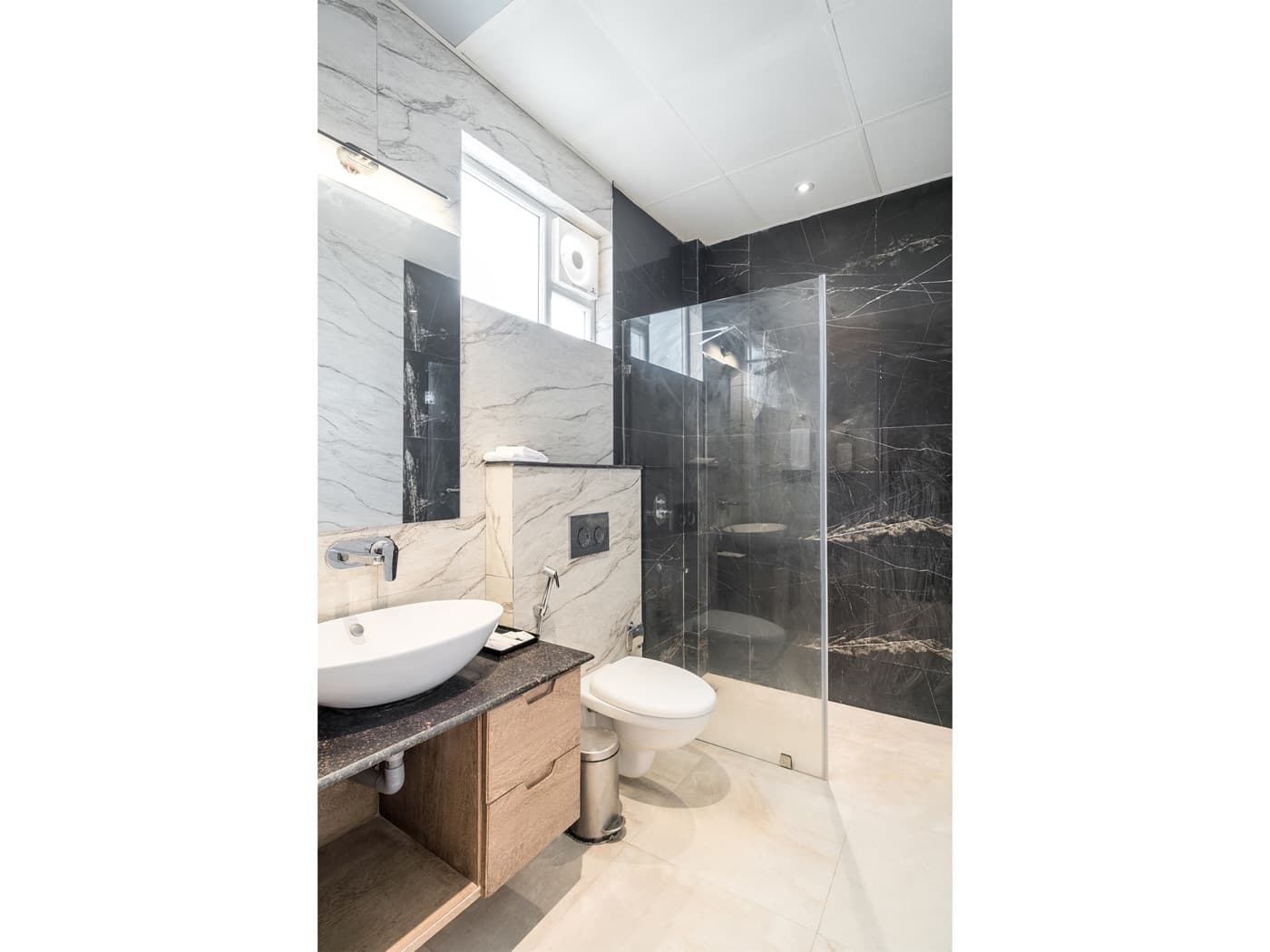 Attached bathroom with modern fittings